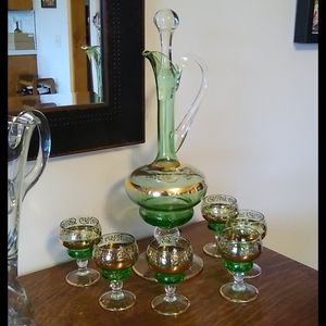 Decanter with six small goblets.
